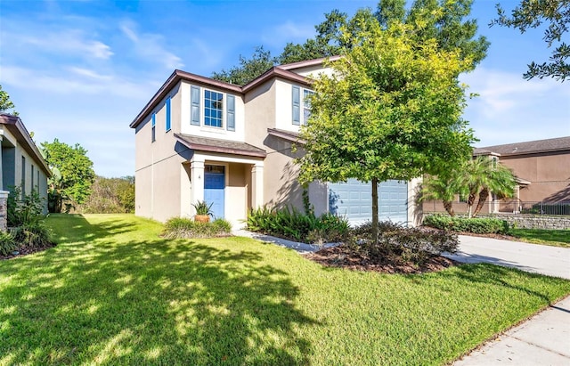 view of front facade with a garage and a front lawn