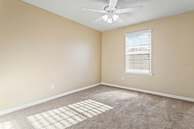 carpeted empty room with ceiling fan