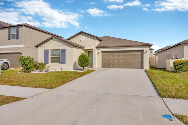 view of front of house featuring a garage and a front lawn