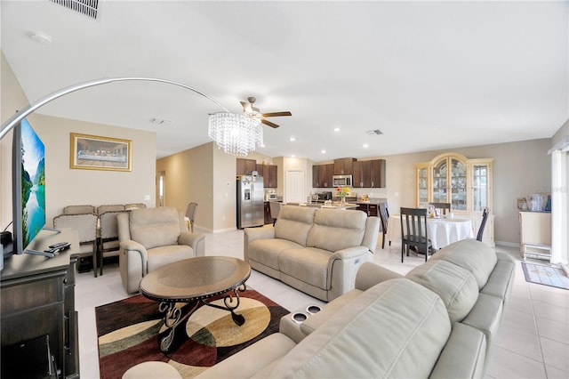 living room featuring ceiling fan and light tile patterned floors