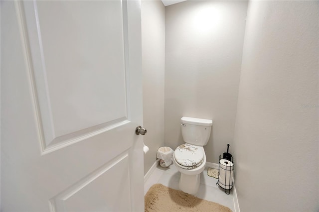 bathroom featuring toilet and tile patterned floors