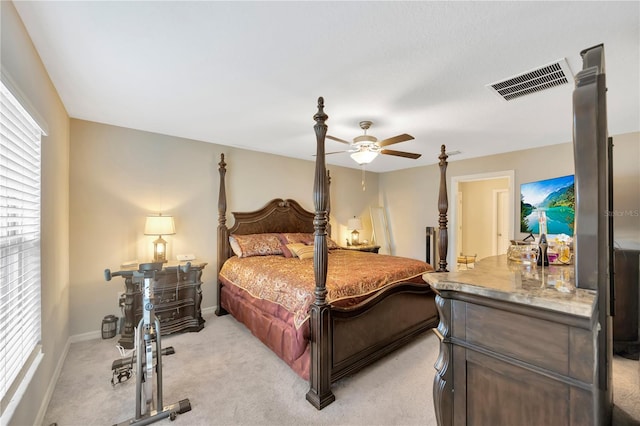 bedroom featuring light carpet and ceiling fan