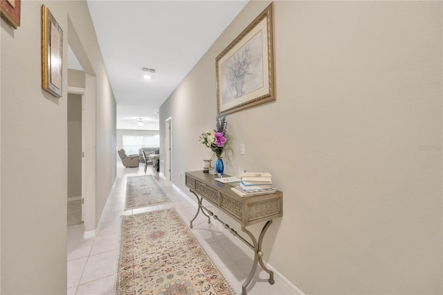 corridor featuring light tile patterned floors