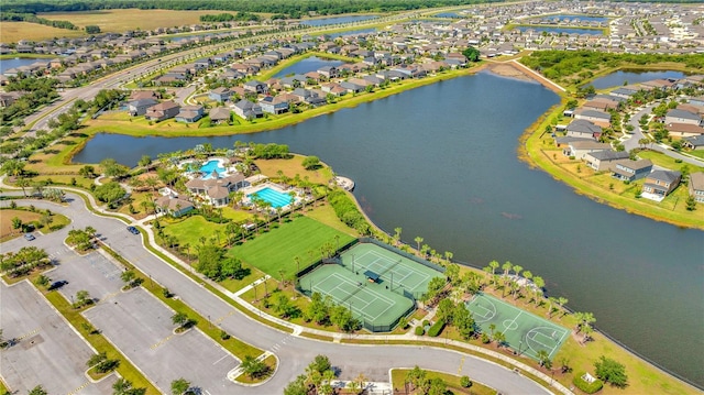 birds eye view of property with a water view