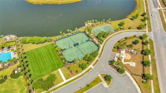 birds eye view of property with a water view