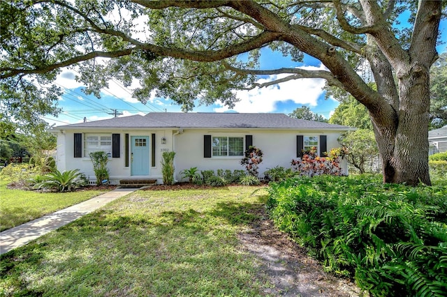 ranch-style home featuring a front yard