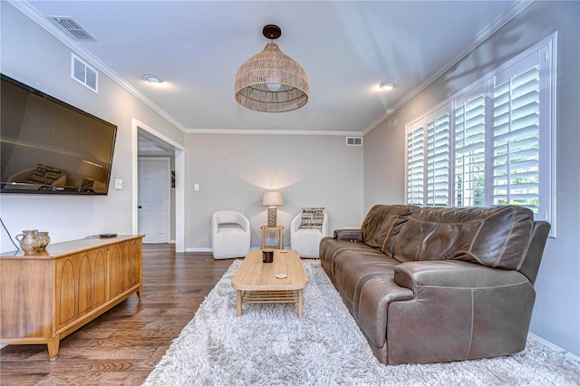 living room with crown molding and dark hardwood / wood-style flooring