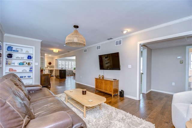 living room featuring ornamental molding and dark wood-type flooring