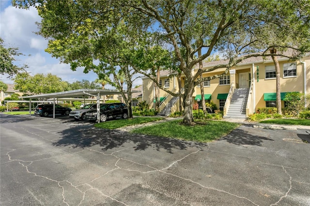 view of front of home featuring a carport