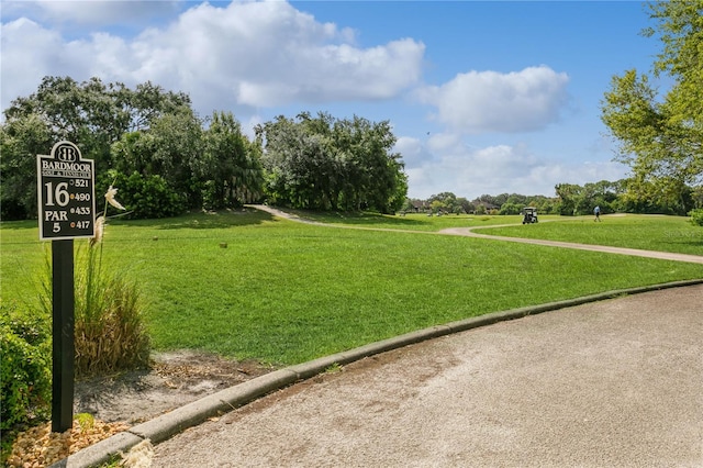 view of home's community featuring a lawn