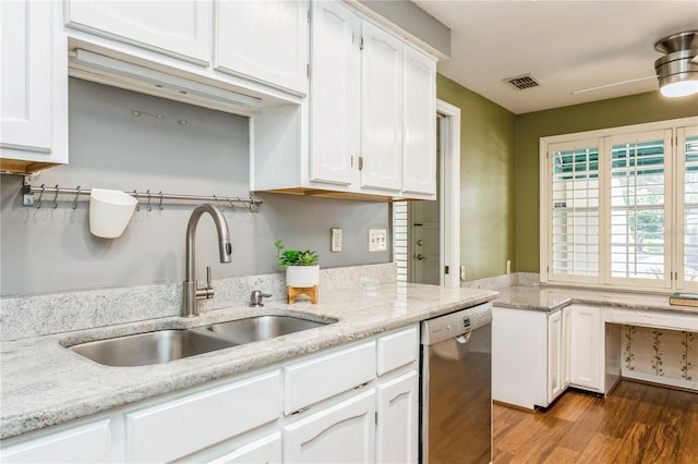 kitchen featuring stainless steel dishwasher, dark hardwood / wood-style floors, sink, and white cabinets