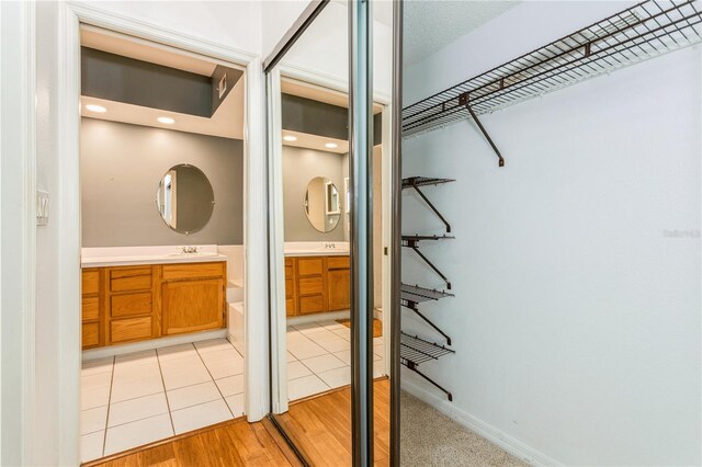 interior space featuring sink and light hardwood / wood-style flooring