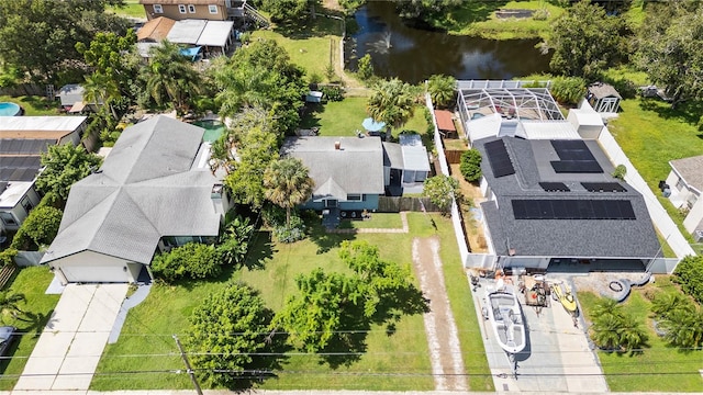 drone / aerial view featuring a residential view and a water view