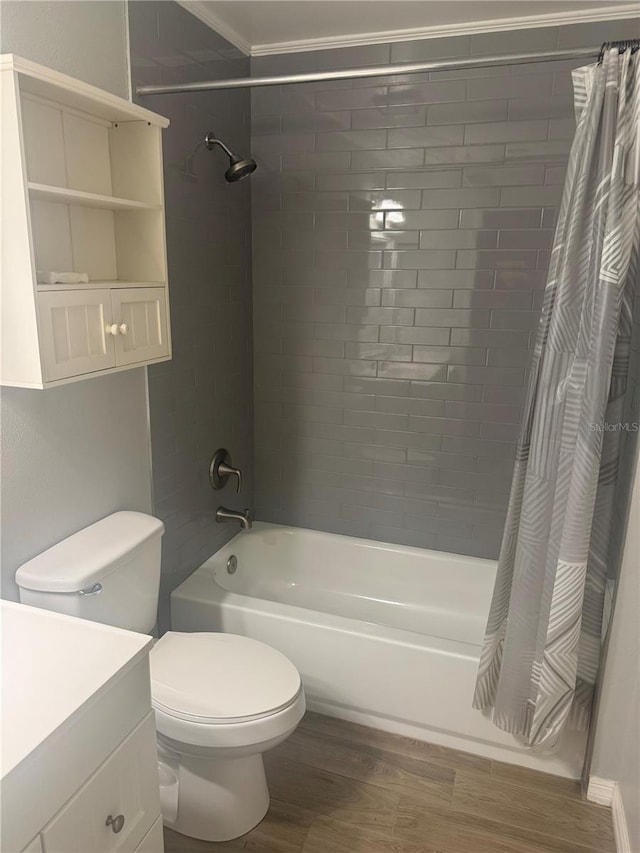 full bathroom with shower / bath combo, hardwood / wood-style flooring, crown molding, vanity, and toilet