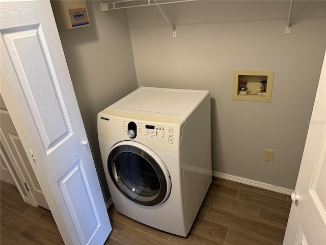 laundry area featuring washer / clothes dryer and dark hardwood / wood-style flooring