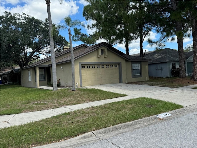 ranch-style house with a garage and a front lawn