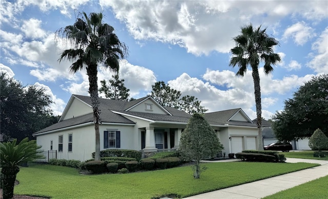 view of front of home with a garage and a front yard