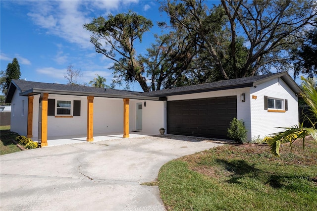 ranch-style home featuring a garage