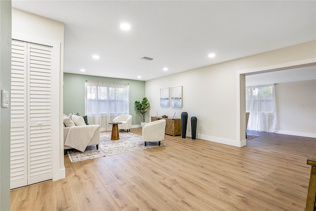 living room with light hardwood / wood-style flooring