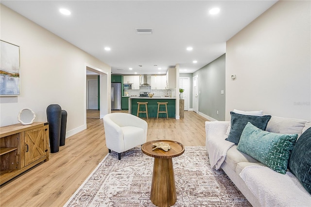 living room with light hardwood / wood-style floors