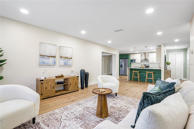 living room with light hardwood / wood-style floors