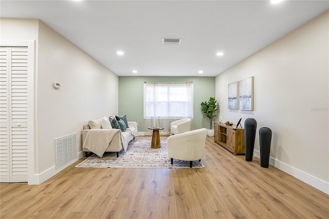 sitting room with light hardwood / wood-style flooring