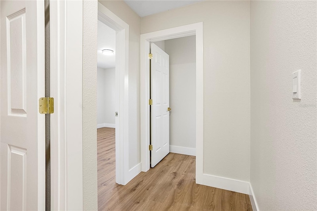 hallway featuring light wood-type flooring