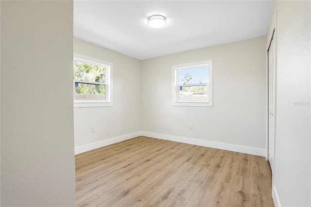 spare room featuring light hardwood / wood-style floors