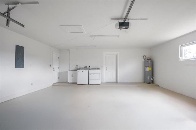 garage featuring separate washer and dryer, water heater, electric panel, and a garage door opener