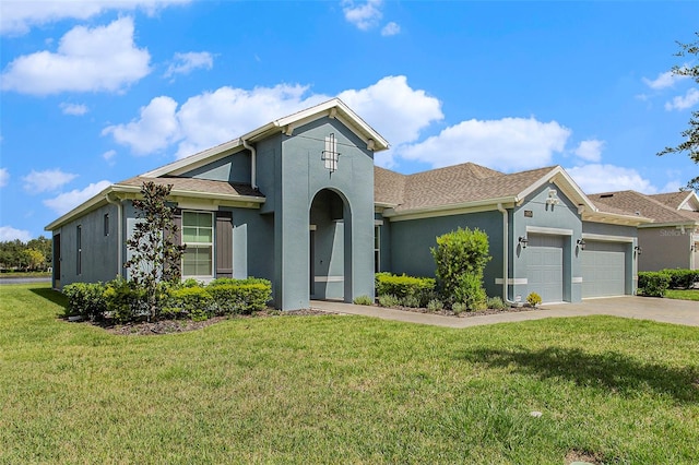 view of front facade featuring a garage and a front lawn