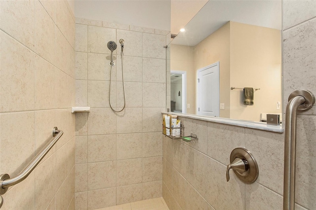 bathroom with a tile shower