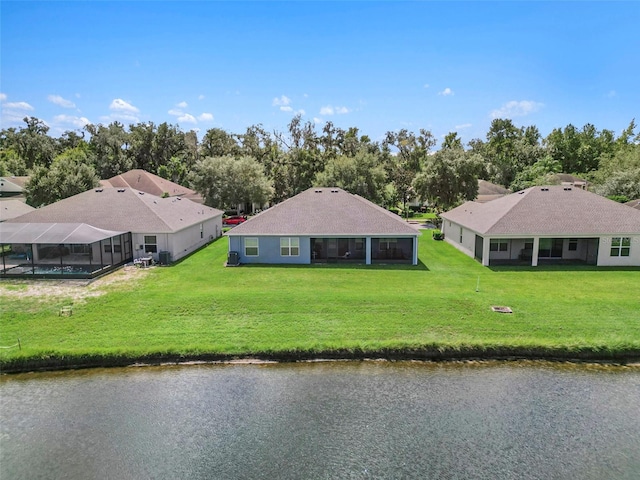 birds eye view of property with a water view