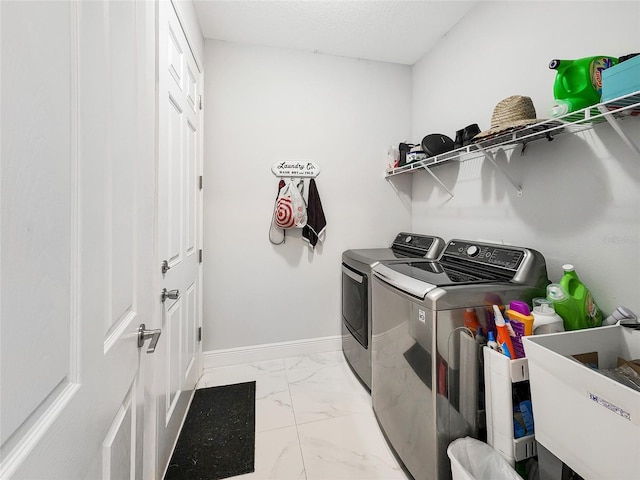 laundry area featuring washer and dryer, sink, and a textured ceiling