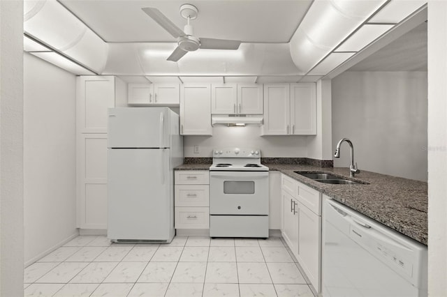 kitchen featuring white cabinetry, sink, dark stone counters, and white appliances