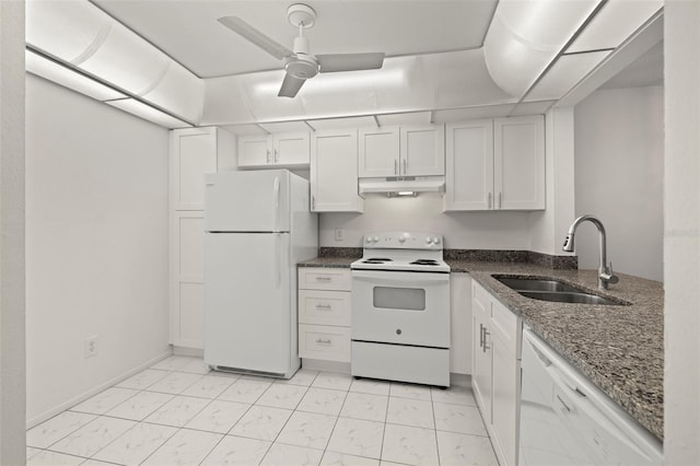 kitchen with white appliances, sink, ceiling fan, white cabinets, and dark stone countertops