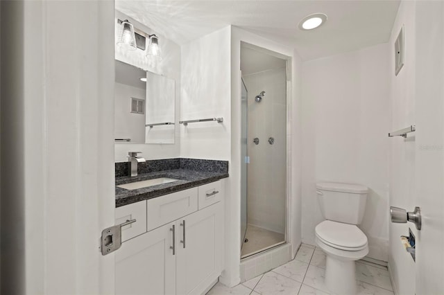 bathroom with vanity, toilet, and an enclosed shower