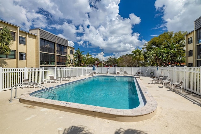 view of swimming pool featuring a patio