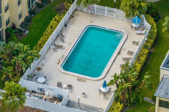 view of pool featuring a yard and a patio area