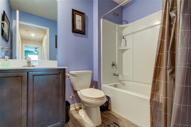 full bathroom with shower / tub combo with curtain, vanity, toilet, and hardwood / wood-style flooring