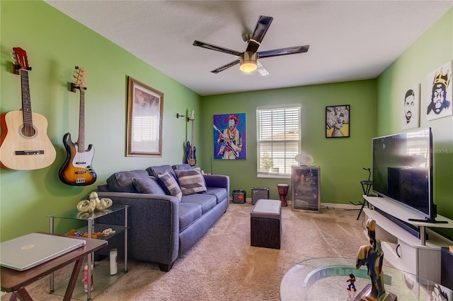 carpeted living room with ceiling fan