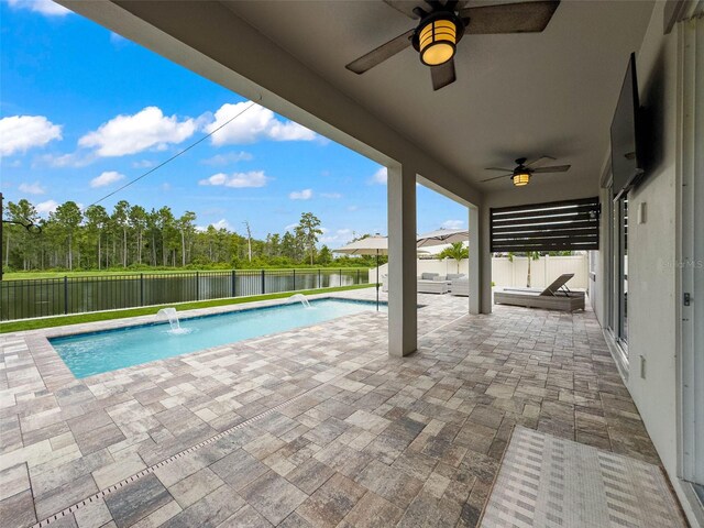 view of swimming pool featuring a ceiling fan, a patio area, a fenced backyard, and a fenced in pool