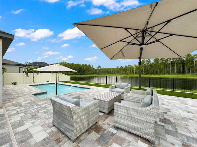 view of pool with a fenced backyard, an outdoor hangout area, and a patio