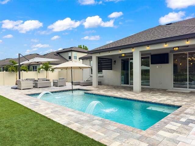 view of pool with a patio, fence, a yard, outdoor lounge area, and a fenced in pool