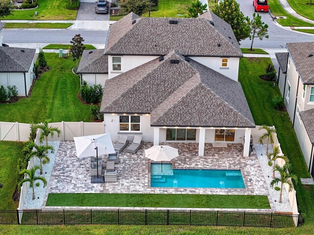 exterior space with a patio, a fenced backyard, and a fenced in pool