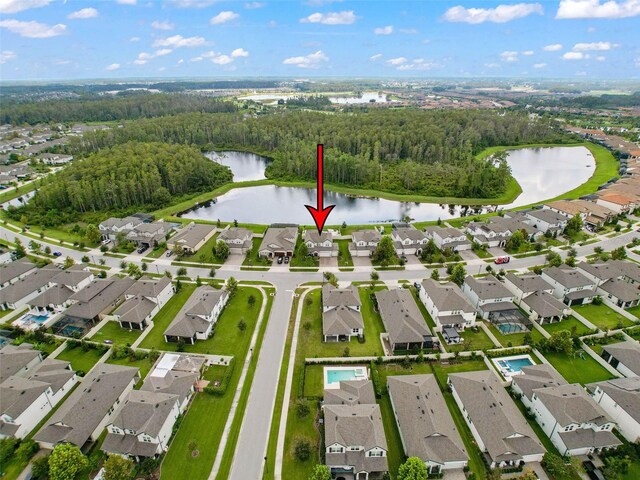 birds eye view of property featuring a residential view and a water view