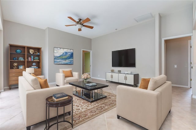 tiled living room featuring ceiling fan