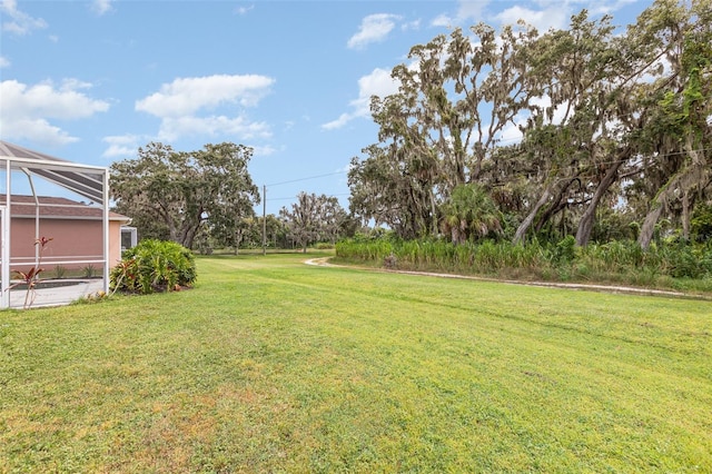 view of yard featuring a lanai