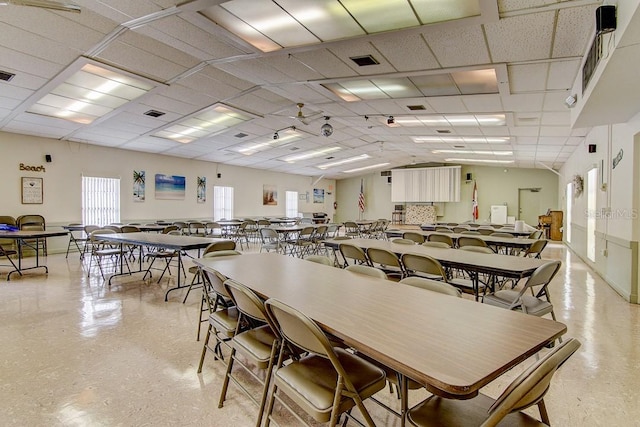 dining area featuring a paneled ceiling