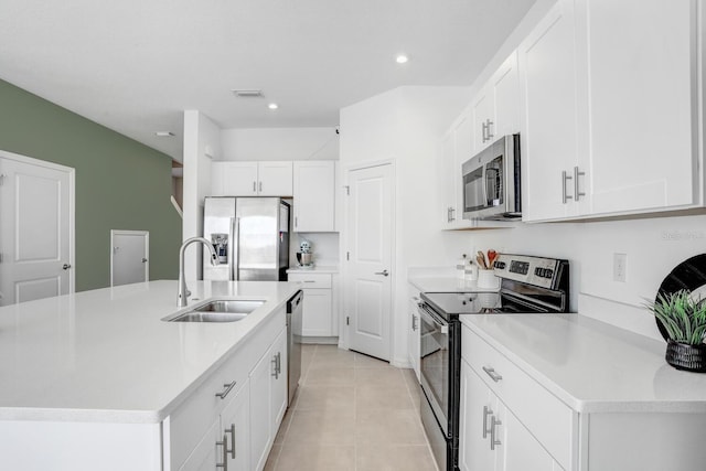 kitchen featuring a center island with sink, stainless steel appliances, sink, and white cabinetry