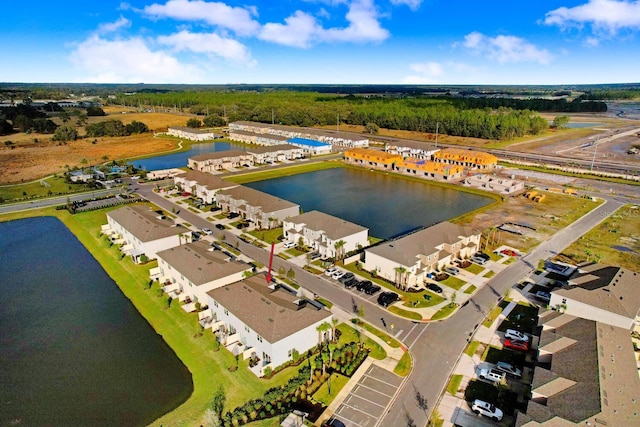 drone / aerial view with a water view